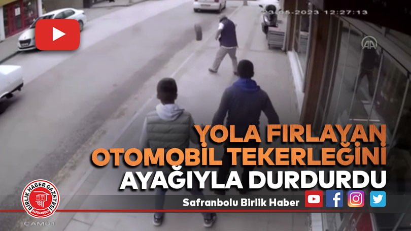Yola fırlayan otomobil tekerleğini ayağıyla durdurdu