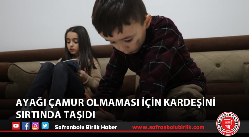 Ayağı çamur olmaması için kardeşini sırtında taşıdı