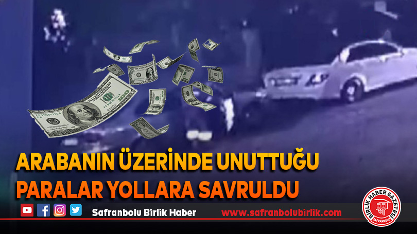 Arabanın üzerinde unuttuğu kağıt paralar yollara savruldu